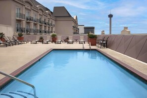 Outdoor pool, open 10:00 AM to 11:00 PM, pool loungers