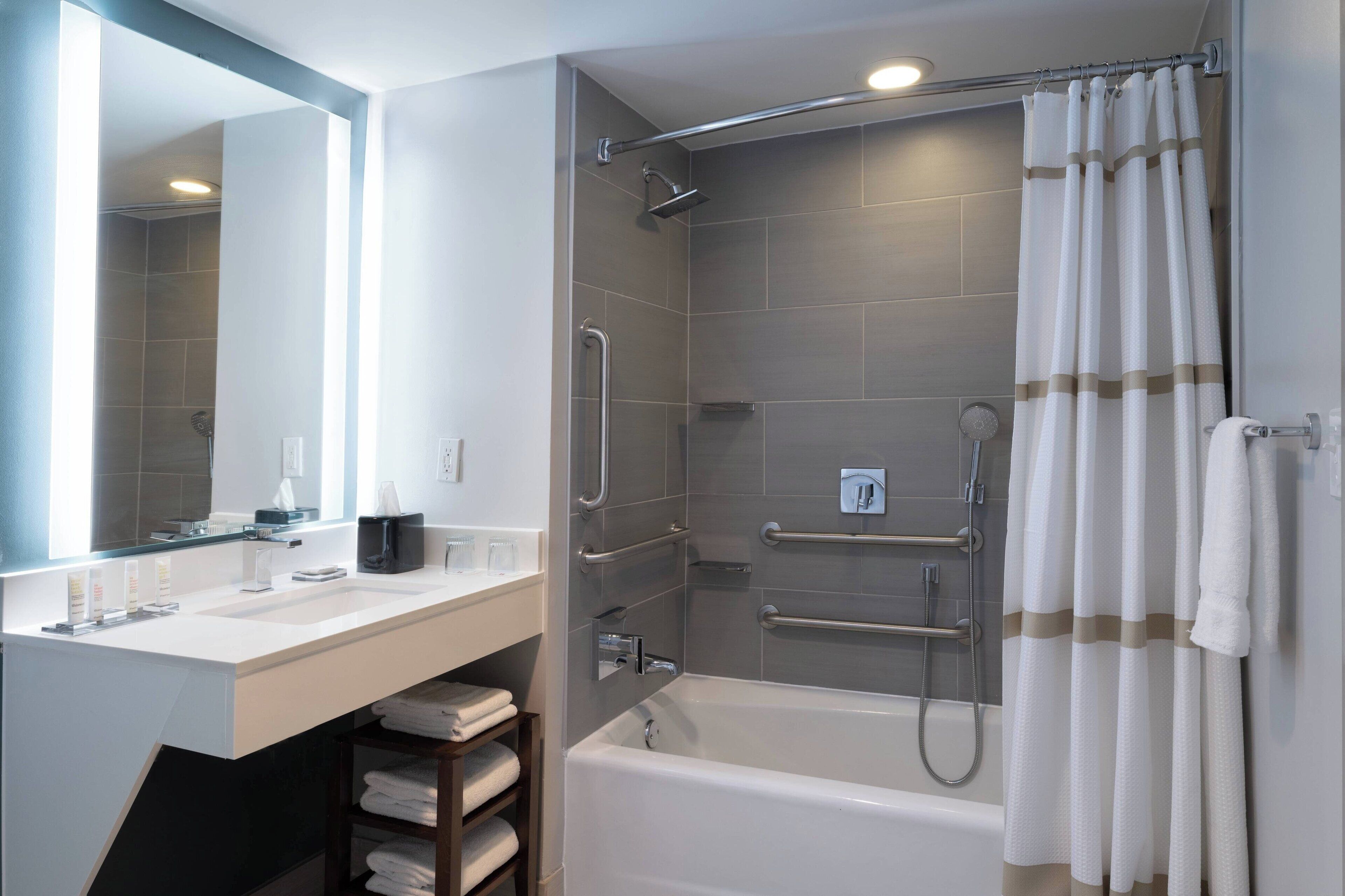 combined shower/bathtub, rainfall showerhead, designer toiletries