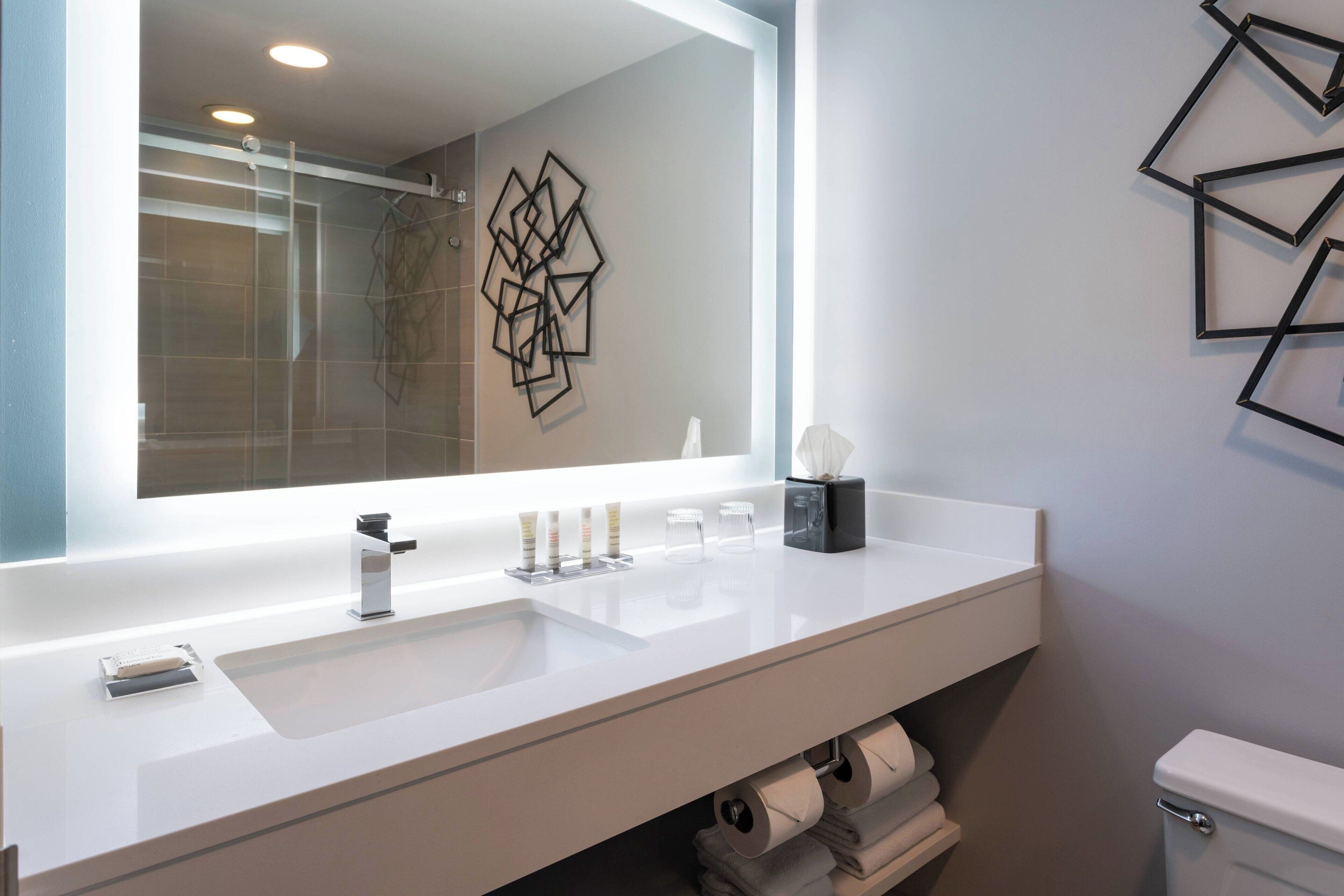 combined shower/bathtub, rainfall showerhead, designer toiletries