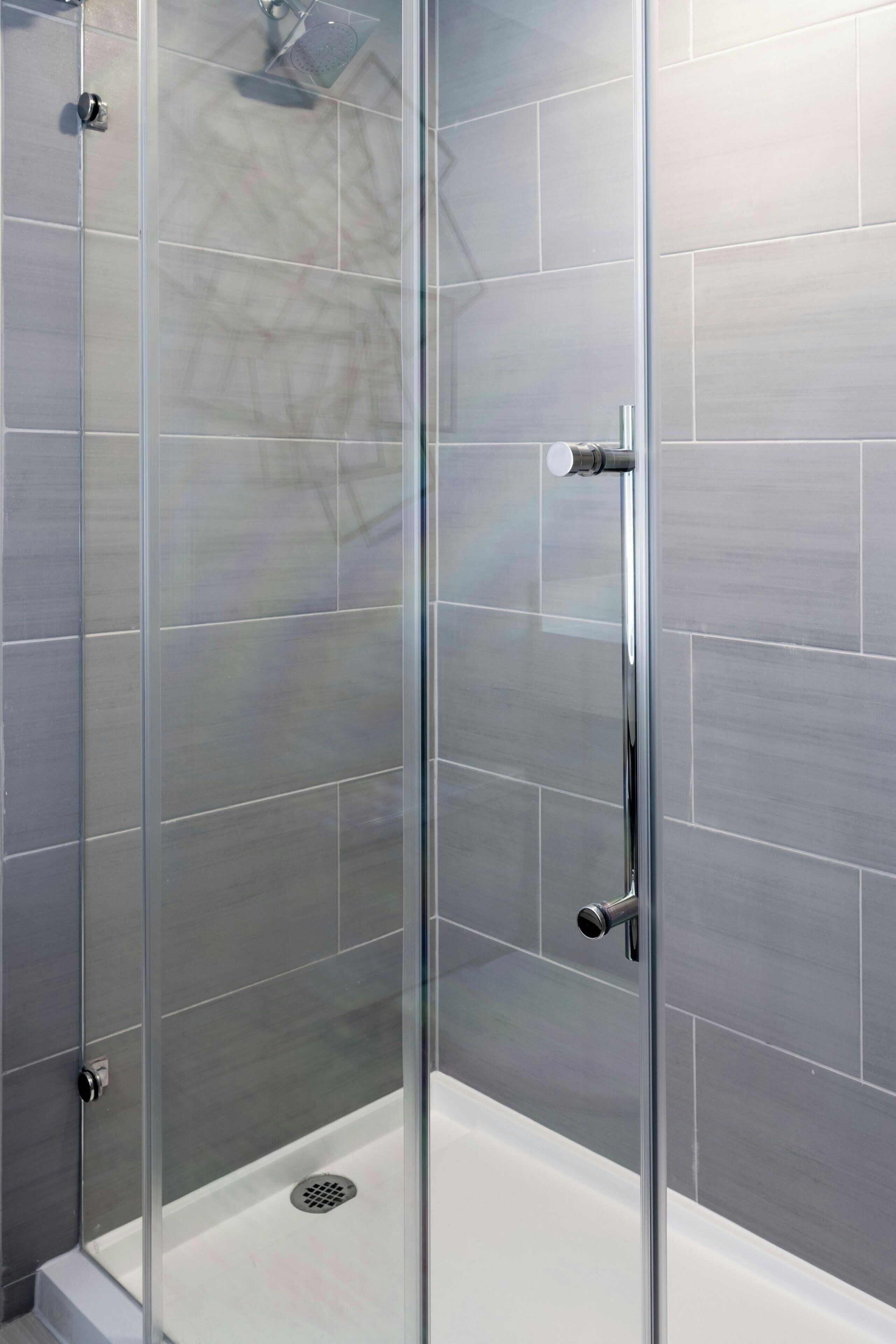 combined shower/bathtub, rainfall showerhead, designer toiletries