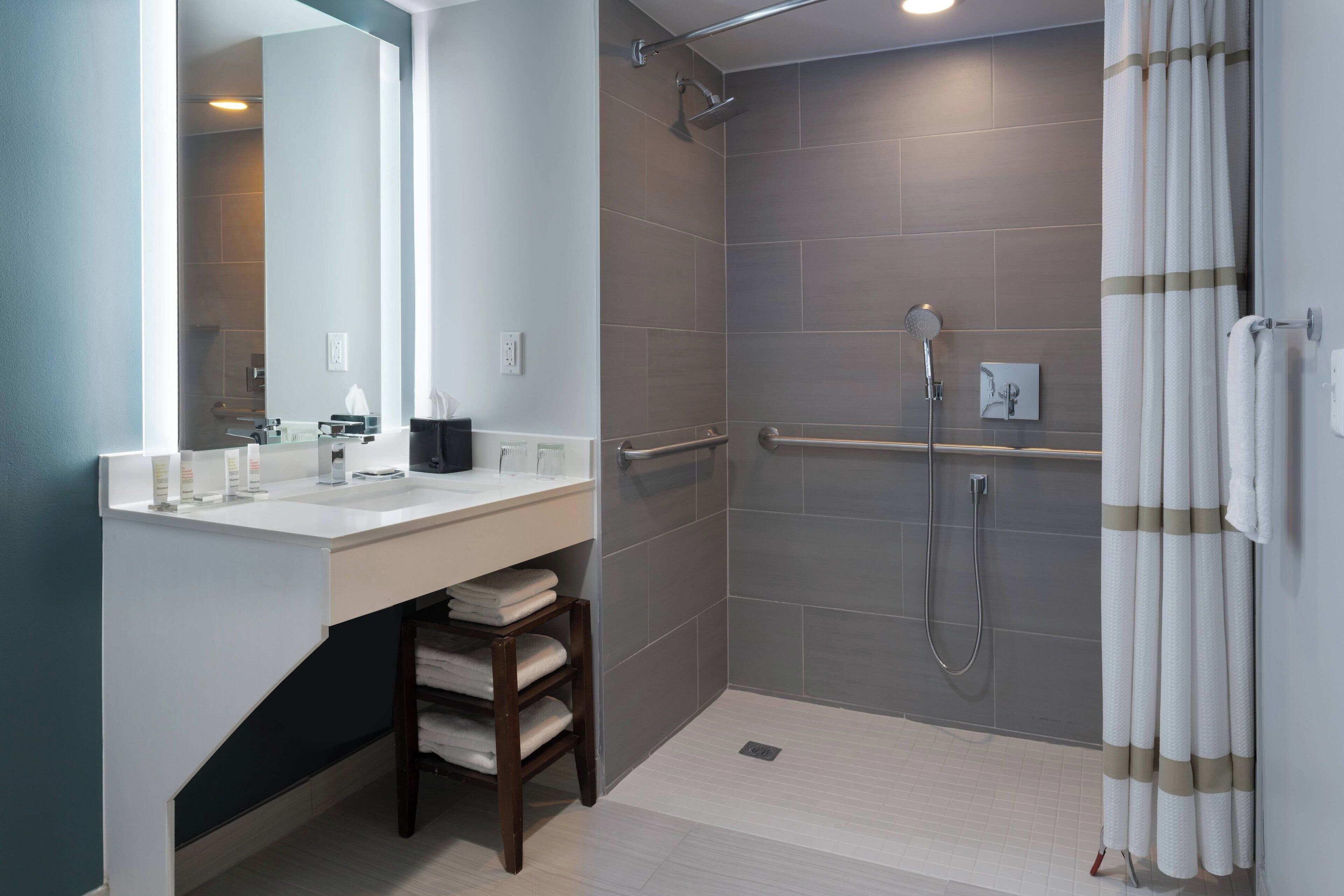 combined shower/bathtub, rainfall showerhead, designer toiletries