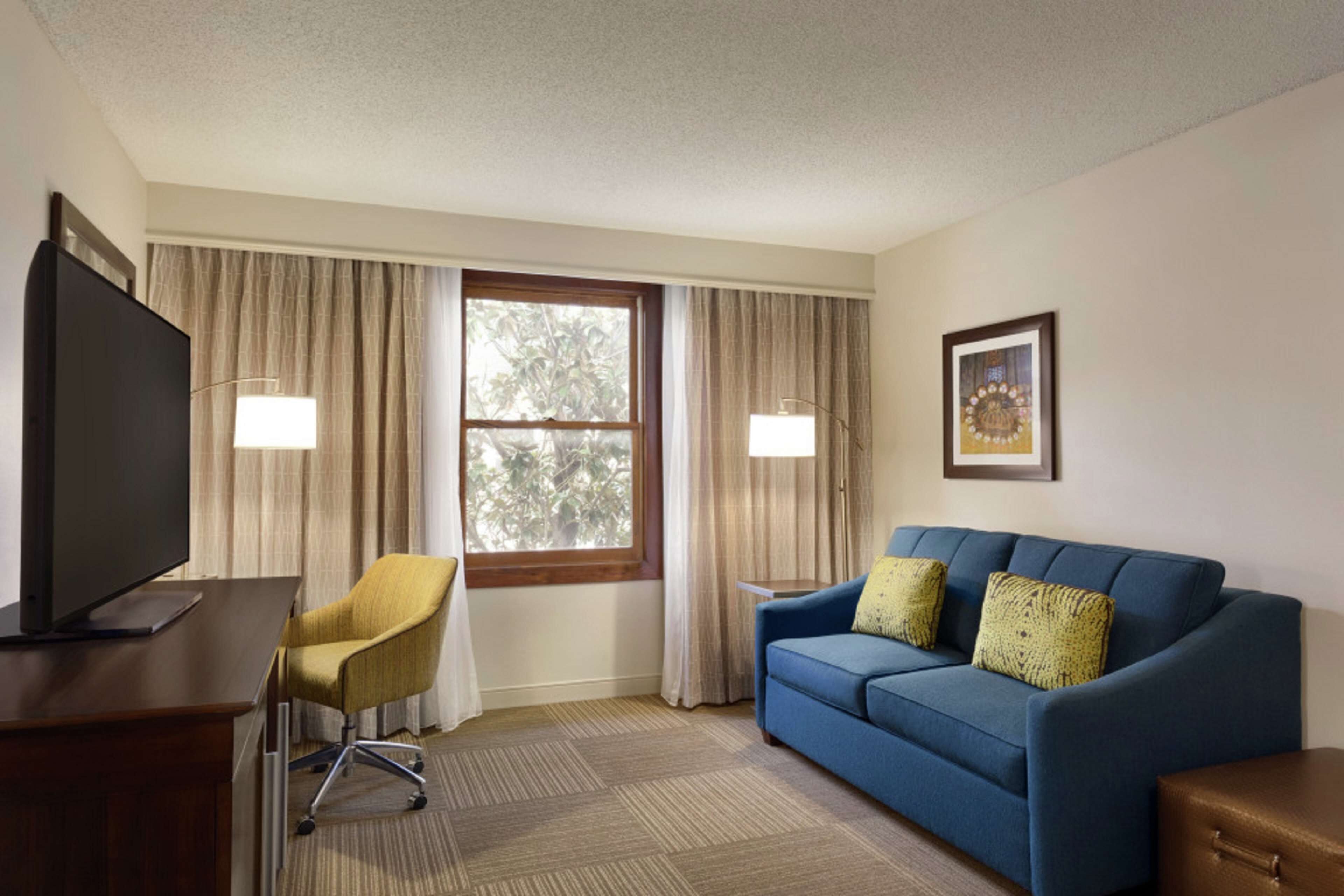 suite, 1 king bed, non smoking, kitchen | in-room safe, desk, iron/ironing board, free cots/infant beds