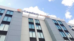 A building with the sign "Comfort Suites" indicating it is a hotel. - Comfort Suites Baymeadows Near Butler Blvd (Jacksonville)