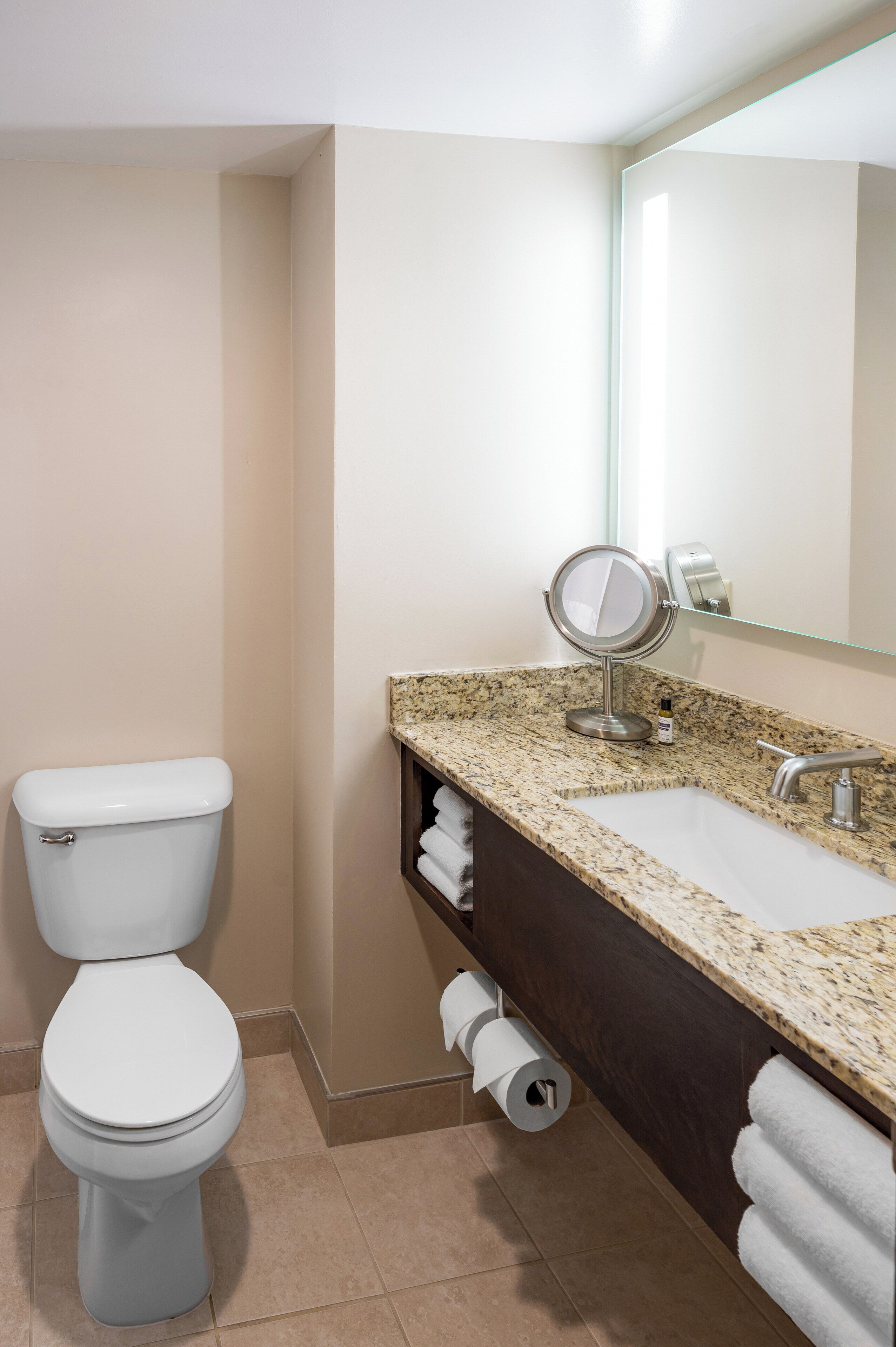 combined shower/bathtub, designer toiletries, hair dryer, towels