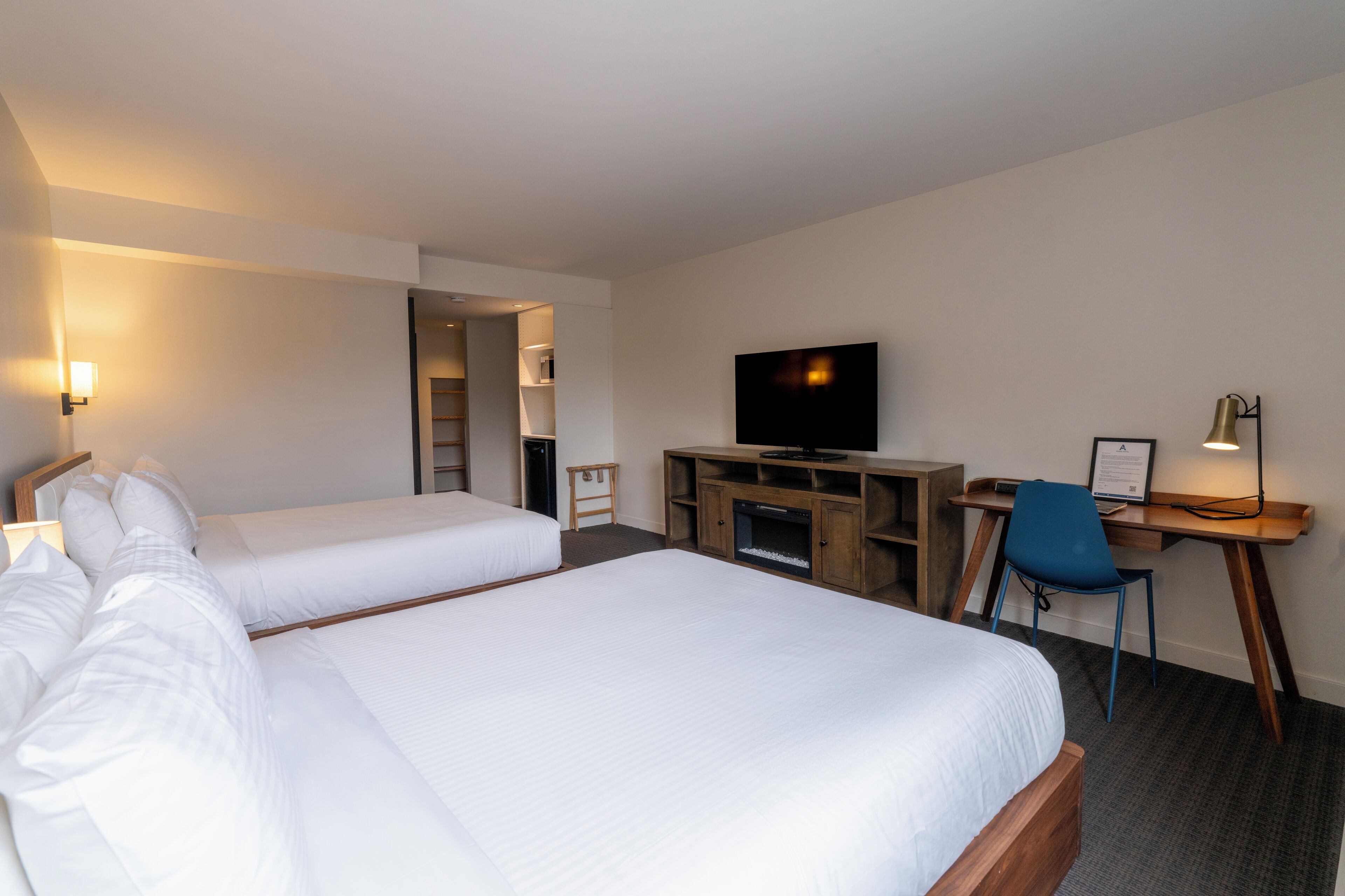 deluxe room, 2 queen beds, city view | 1 bedroom, premium bedding, iron/ironing board, free cots/infant beds