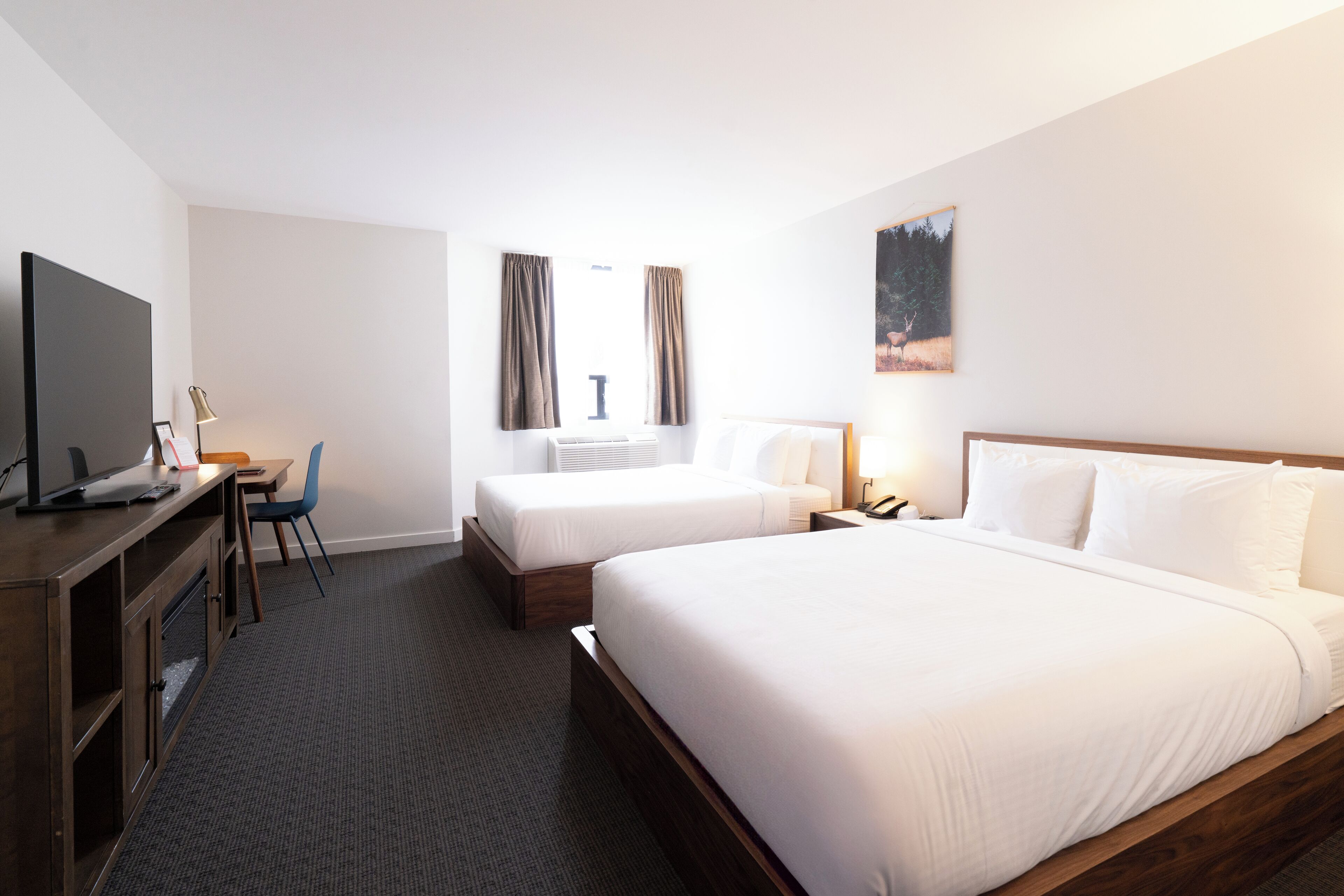 deluxe room, 2 queen beds, city view | 1 bedroom, premium bedding, iron/ironing board, free cots/infant beds