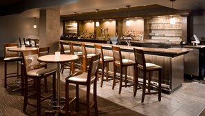 A bar area with seating and a counter. - The Madison Concourse Hotel and Governor's Club (Madison)