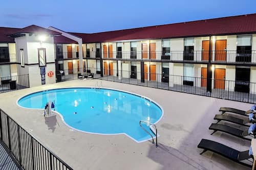 Seasonal outdoor pool, open 9:00 AM to 10:00 PM, pool umbrellas