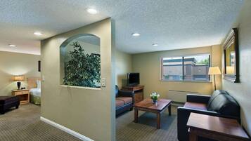 Premium bedding, desk, laptop workspace, iron/ironing board