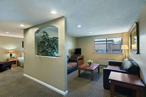 Premium bedding, desk, laptop workspace, iron/ironing board