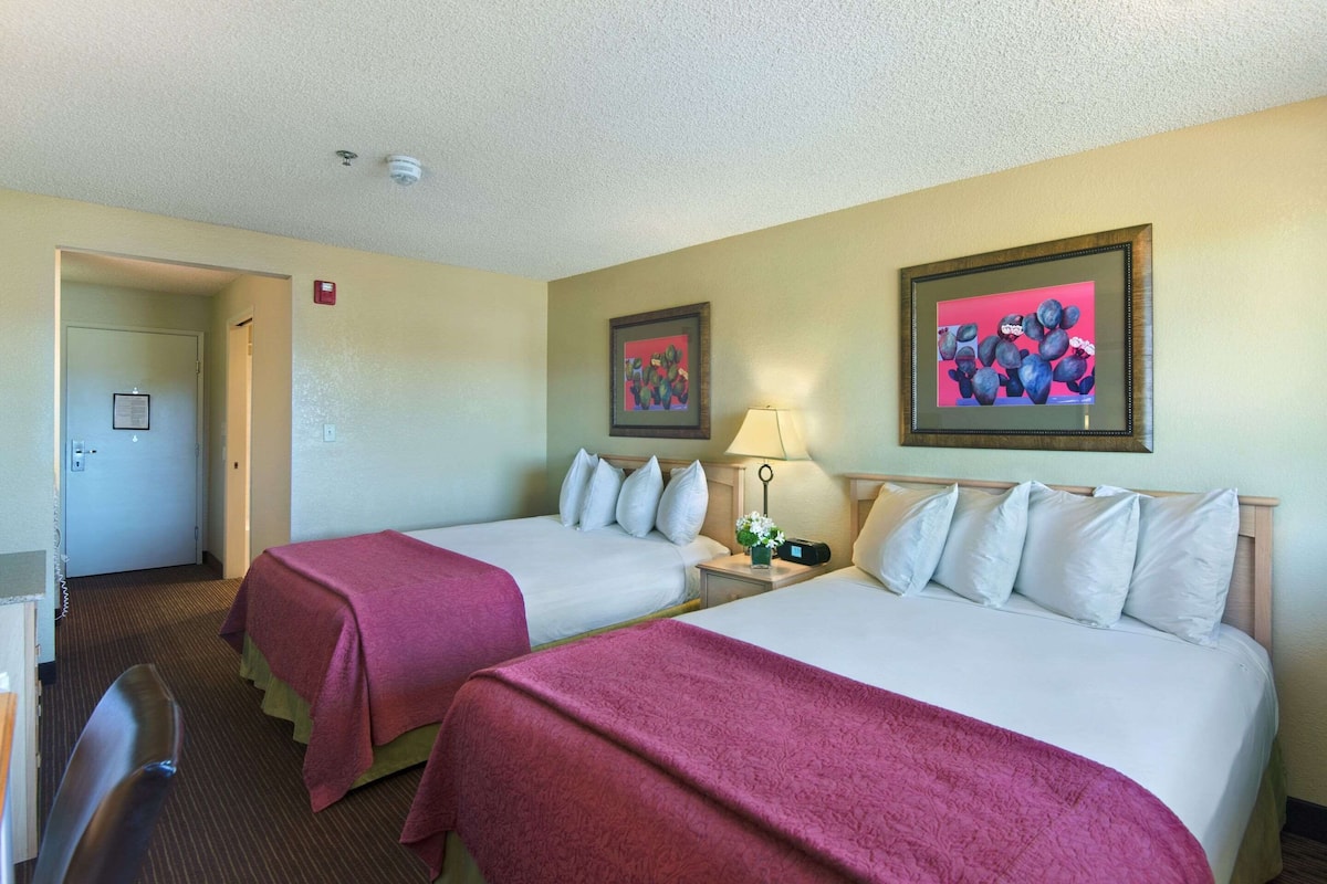 Premium bedding, desk, laptop workspace, iron/ironing board