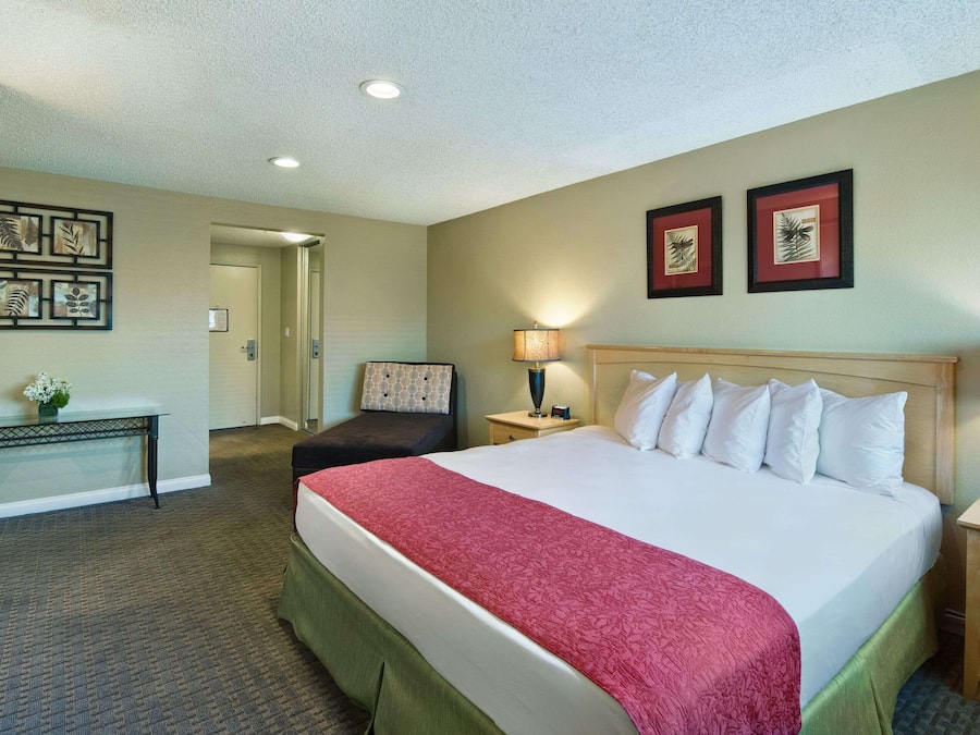 Premium bedding, desk, laptop workspace, iron/ironing board