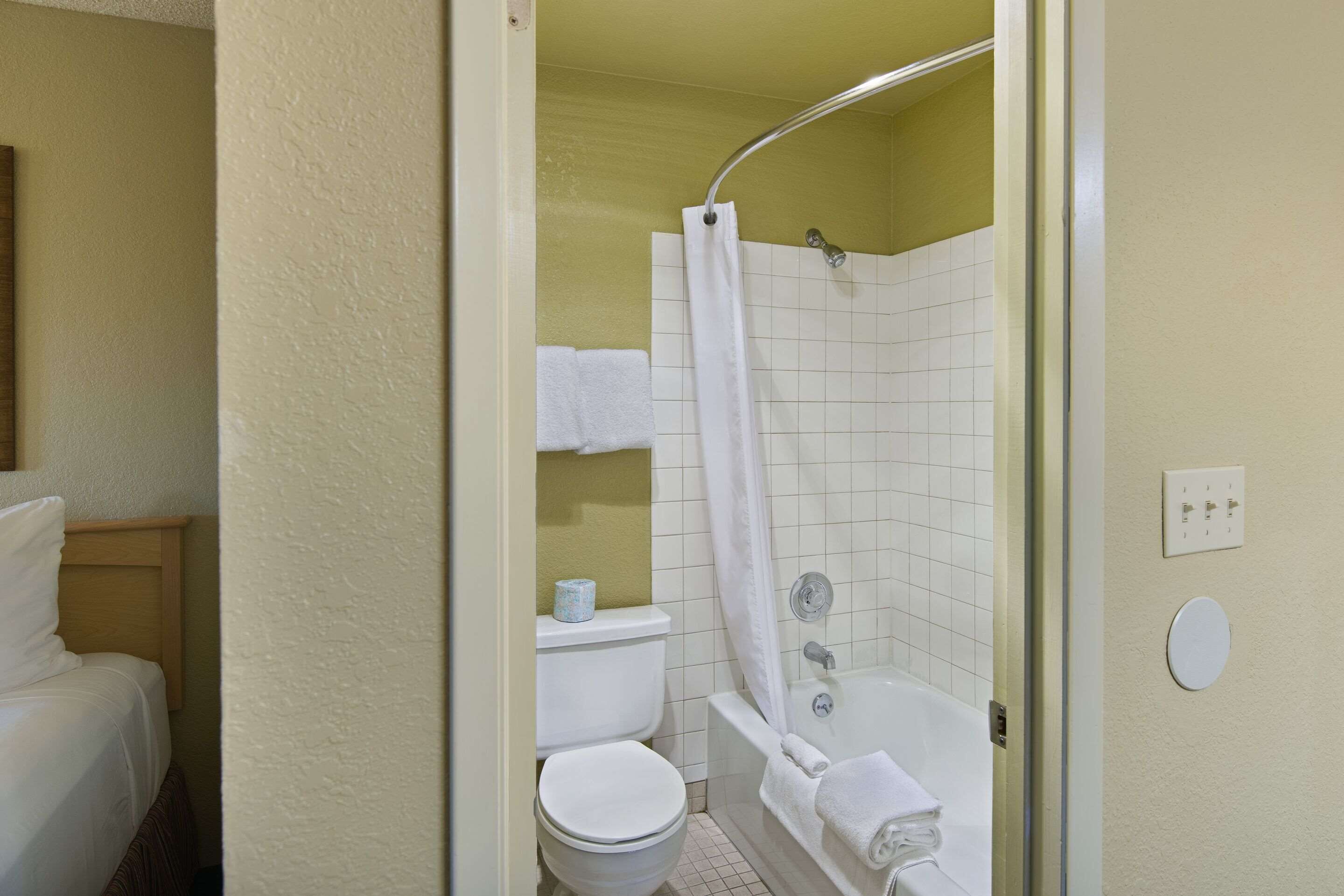 premium bedding, desk, laptop workspace, iron/ironing board