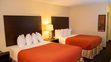 Value Double Queen Room | Premium bedding, pillowtop beds, desk, blackout drapes