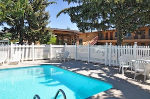 Seasonal outdoor pool, pool umbrellas, pool loungers