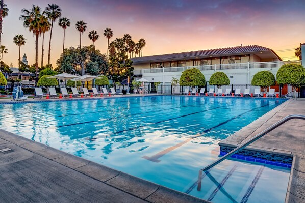Outdoor pool, a heated pool, open 8 AM to 10 PM, pool umbrellas