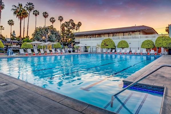 Outdoor pool, a heated pool, open 8 AM to 10 PM, pool umbrellas