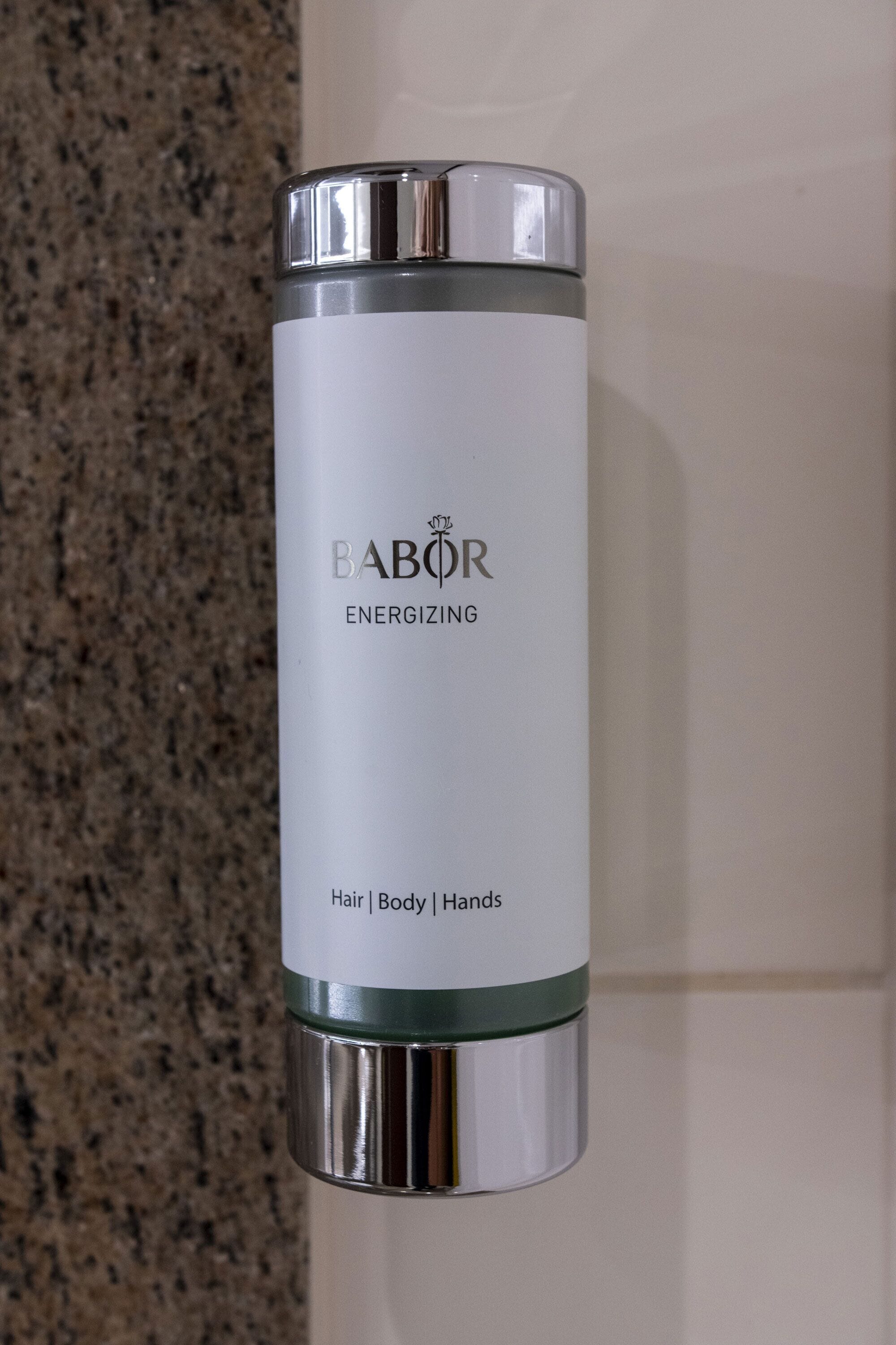 A cylindrical container labeled "BABOR ENERGYIZING" with "Hair | Body | Hands" text.