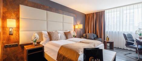 Ropa de cama hipoalergénica, minibar, caja fuerte