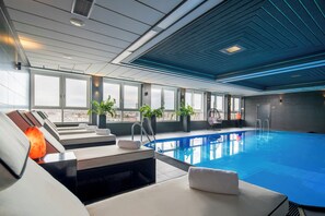 Indoor pool, open 3:00 PM to 10:00 PM, pool loungers