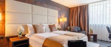 Literie hypoallergénique, minibar, coffres-forts dans les chambres