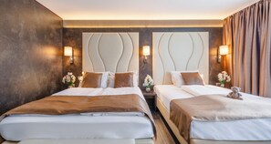 Triple Room | Hypo-allergenic bedding, minibar, in-room safe, individually furnished