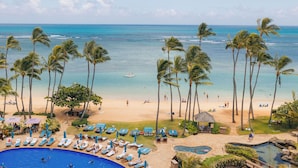 A resort with a pool, beach, and palm trees. - The Kahala Hotel & Resort (Honolulu)