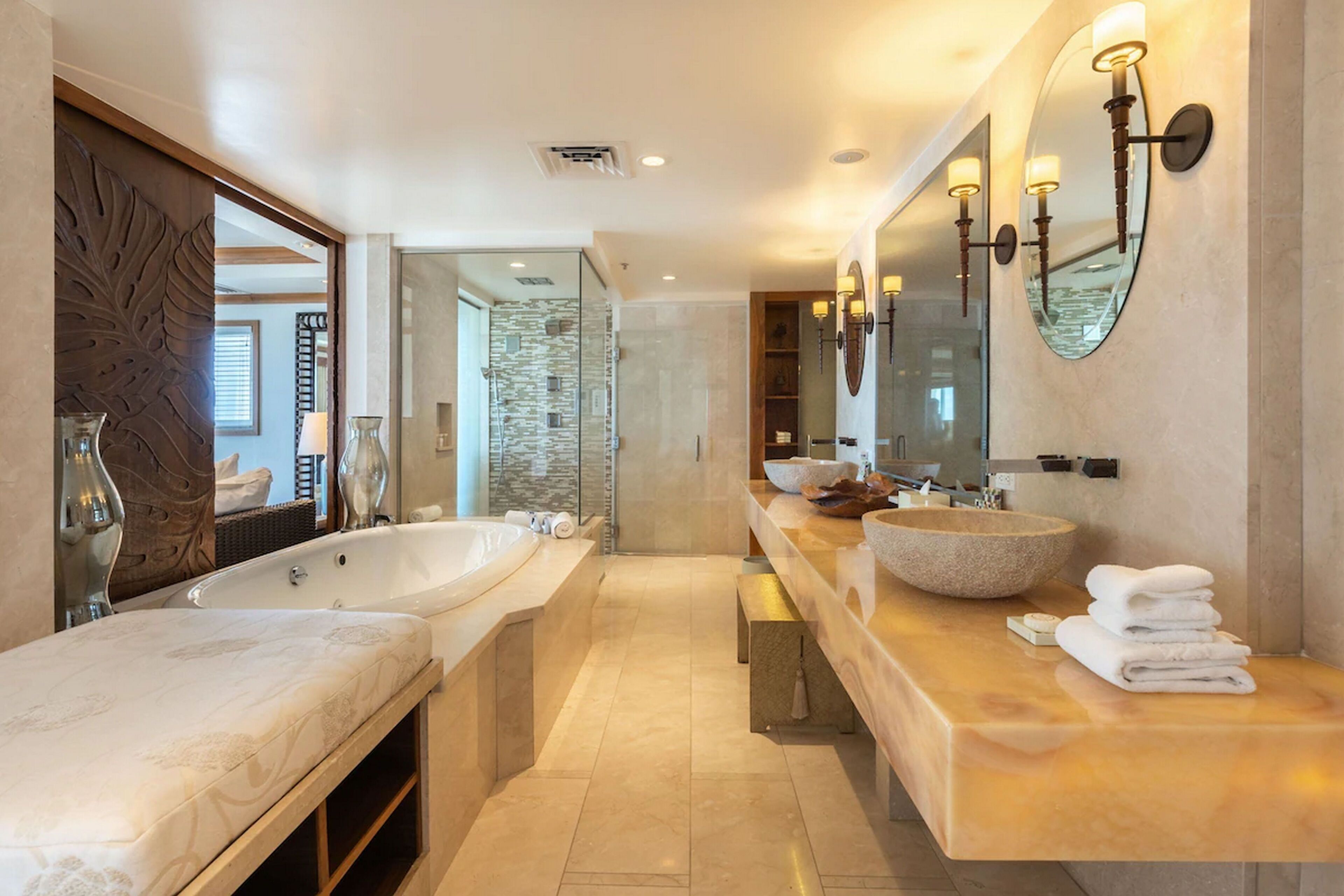 separate bathtub and shower, deep-soaking bathtub, designer toiletries