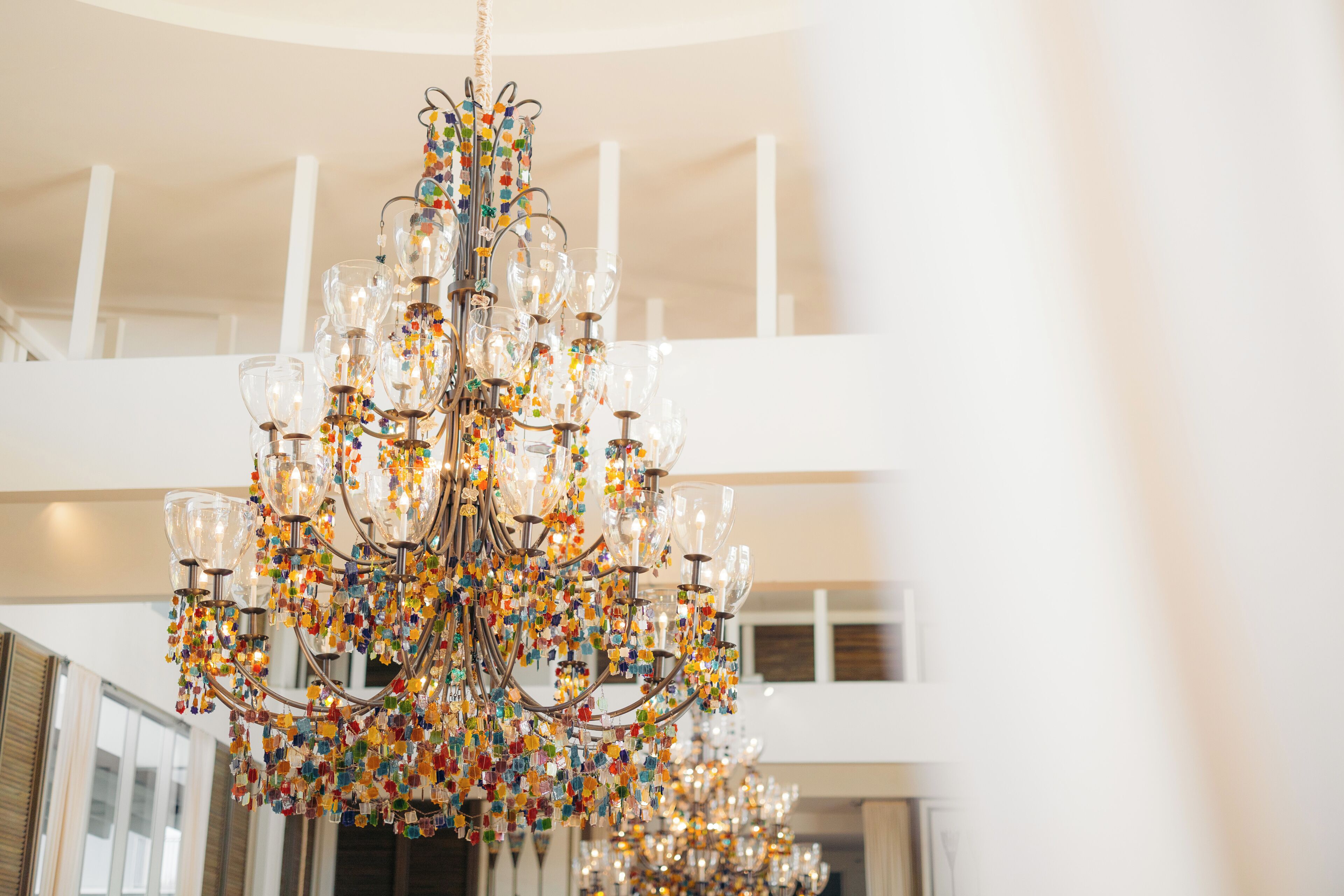 A chandelier with multiple glass shades and a metal frame.