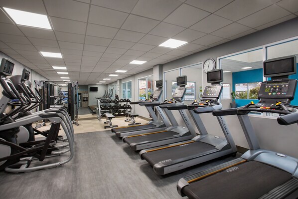 A gym with treadmills, exercise bikes, and weight machines. - Crowne Plaza San Francisco Airport by IHG (Burlingame)
