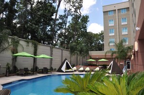 Outdoor pool, open 6:00 AM to 11:00 PM, free cabanas, pool umbrellas