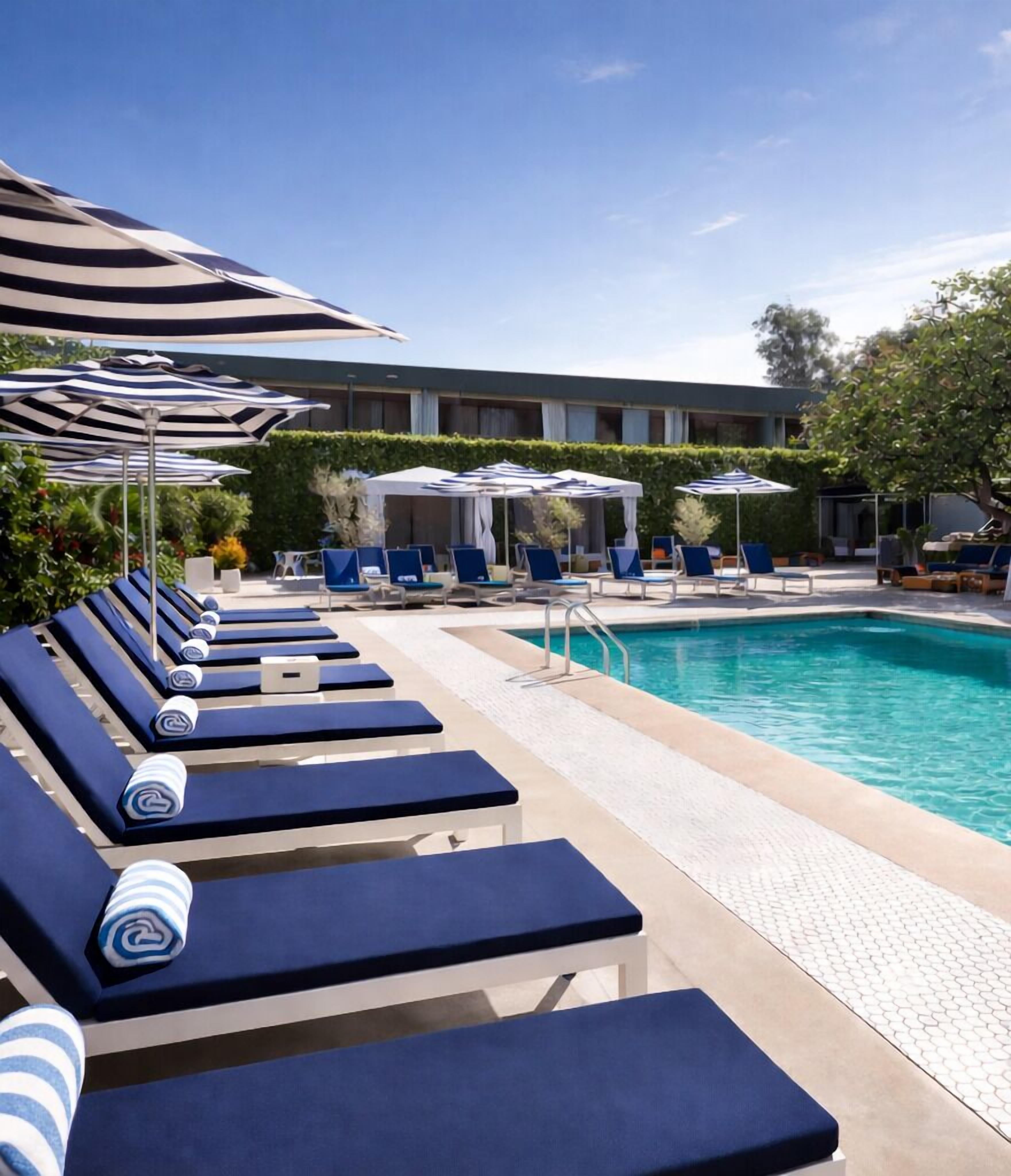 Outdoor pool, open 7:00 AM to 10:00 PM, cabanas (surcharge)