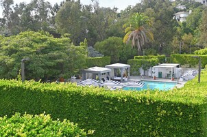 Outdoor pool, open 7:00 AM to 10:00 PM, cabanas (surcharge)