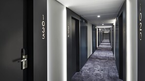 A hotel hallway with doors numbered 1035, 1034, and 1020. - Orea Congress hotel Brno (Brno)