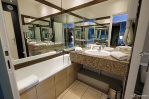 Combined shower/tub, hair dryer, towels, soap
