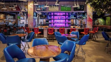 A bar area with seating and a bar counter.