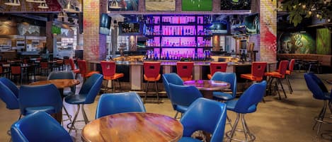 A bar area with seating and a bar counter.