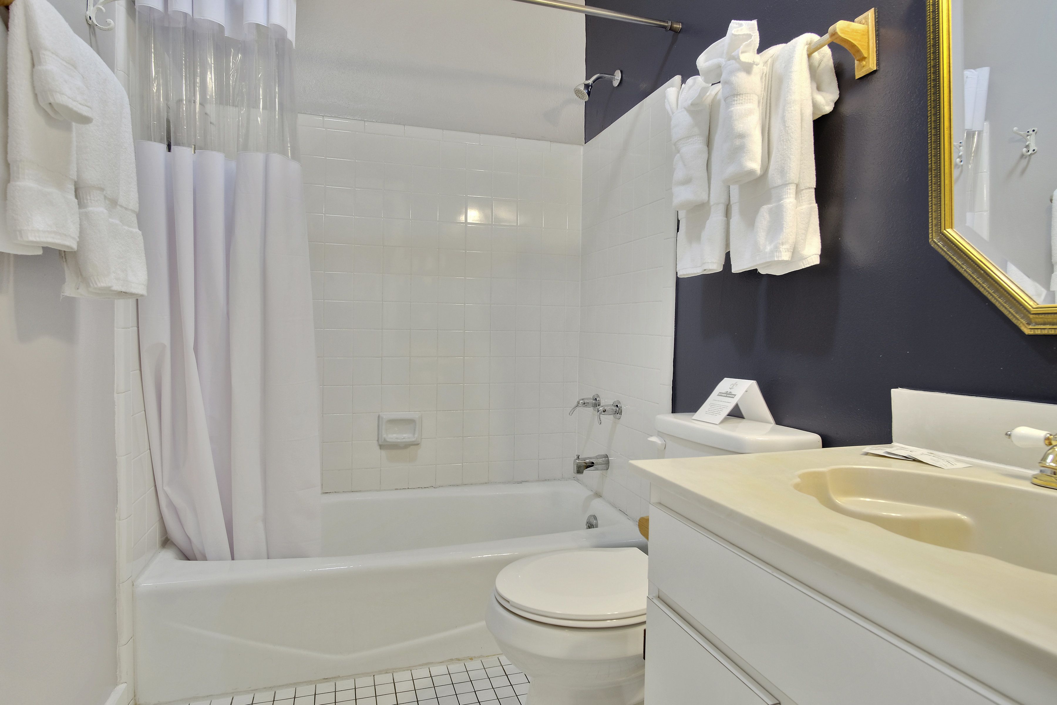 suite, multiple beds | bathroom | designer toiletries, hair dryer, towels