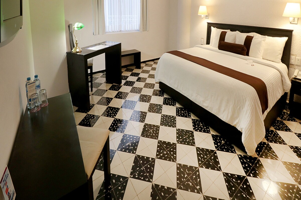 Down comforters, pillowtop beds, in-room safe, desk