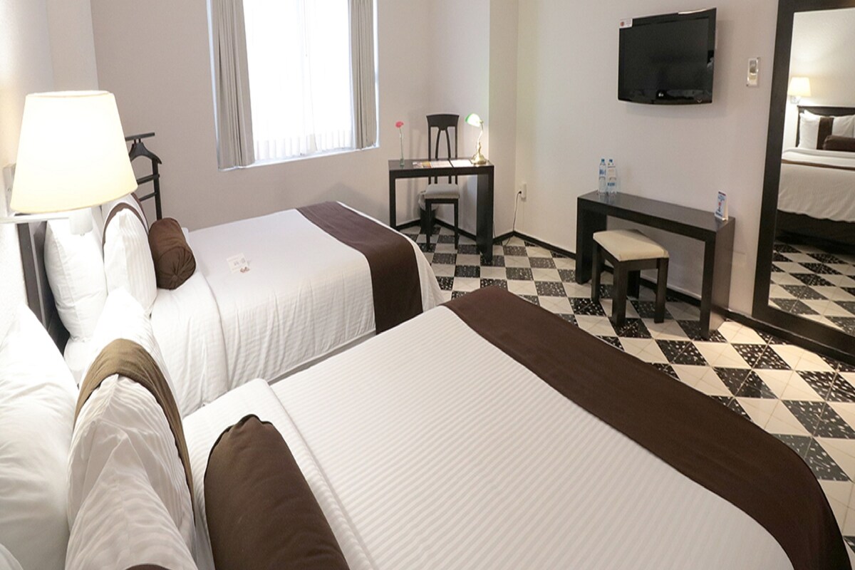 Down comforters, pillowtop beds, in-room safe, desk