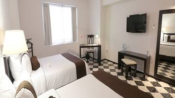 Down duvets, pillow-top beds, in-room safe, desk