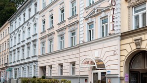 A historic hotel building with a classic facade, multiple windows, and a prominent "HOTEL" sign. - Altstadthotel Wolf-Dietrich (Salzburg)