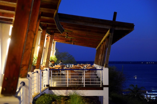 Breakfast, lunch, dinner served; local cuisine