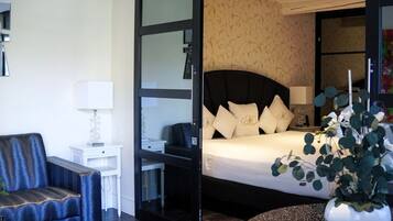 Suite, Garden View | Premium bedding, minibar, in-room safe, desk