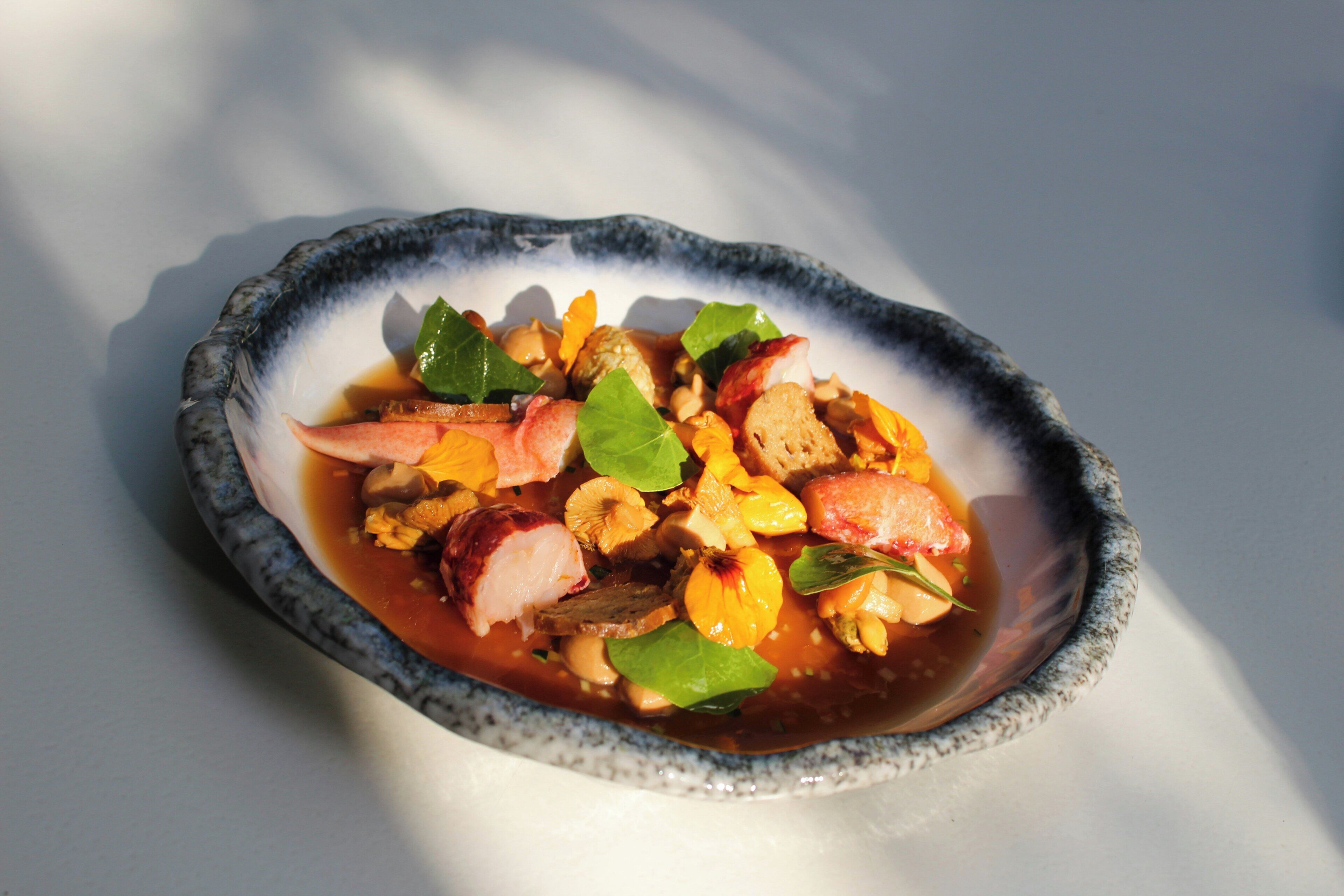 A bowl of food with various ingredients.