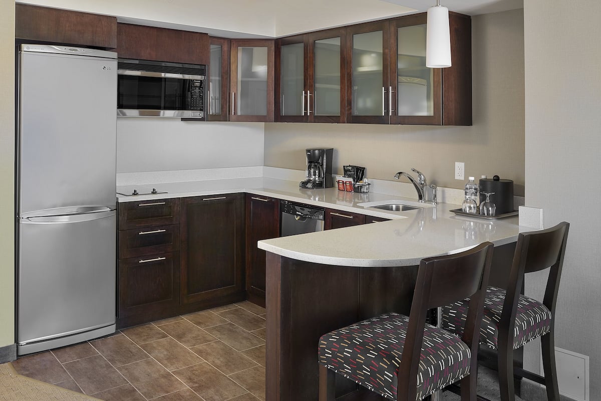 full-sized fridge, microwave, stovetop, dishwasher