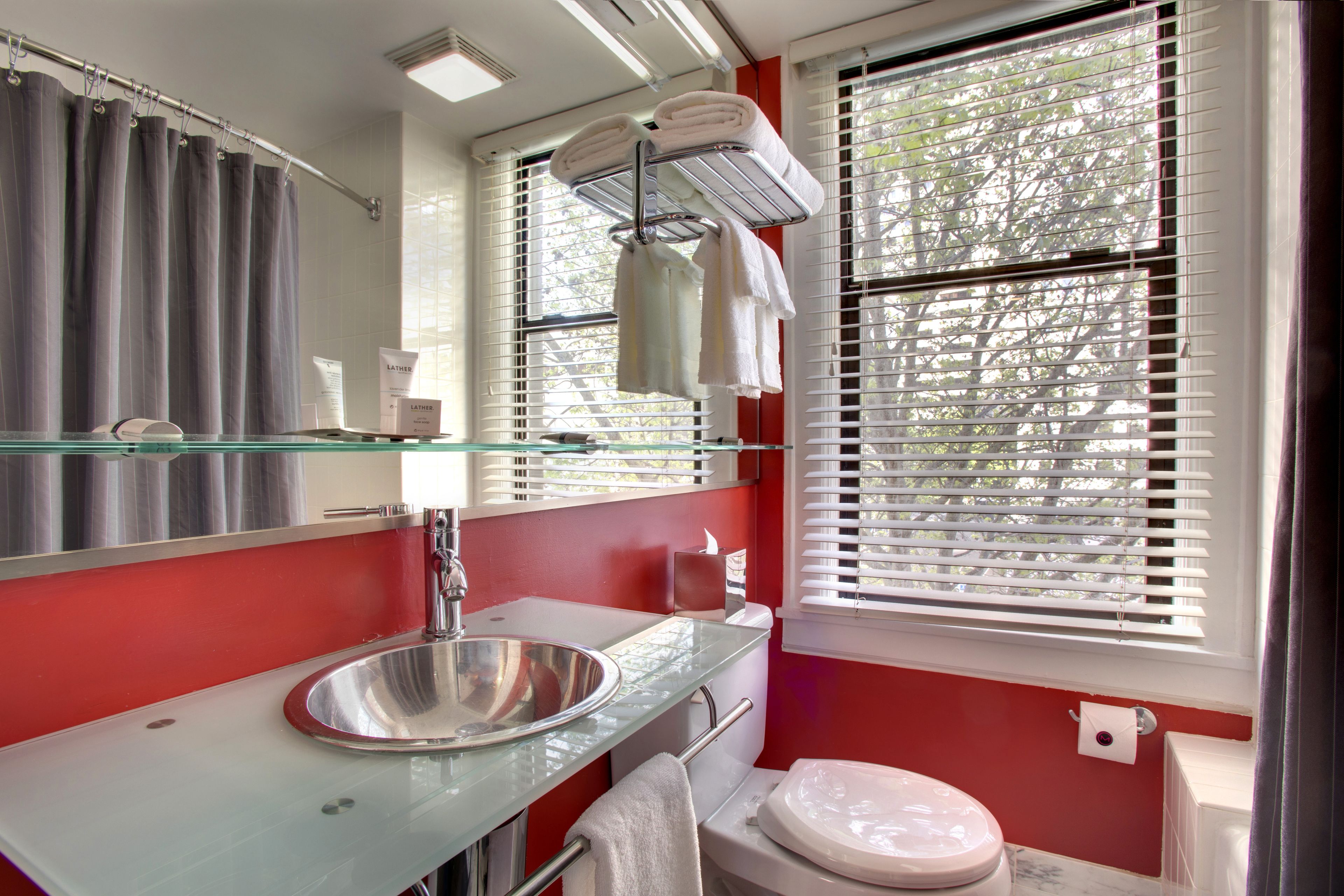 combined shower/bathtub, designer toiletries, hair dryer, bathrobes