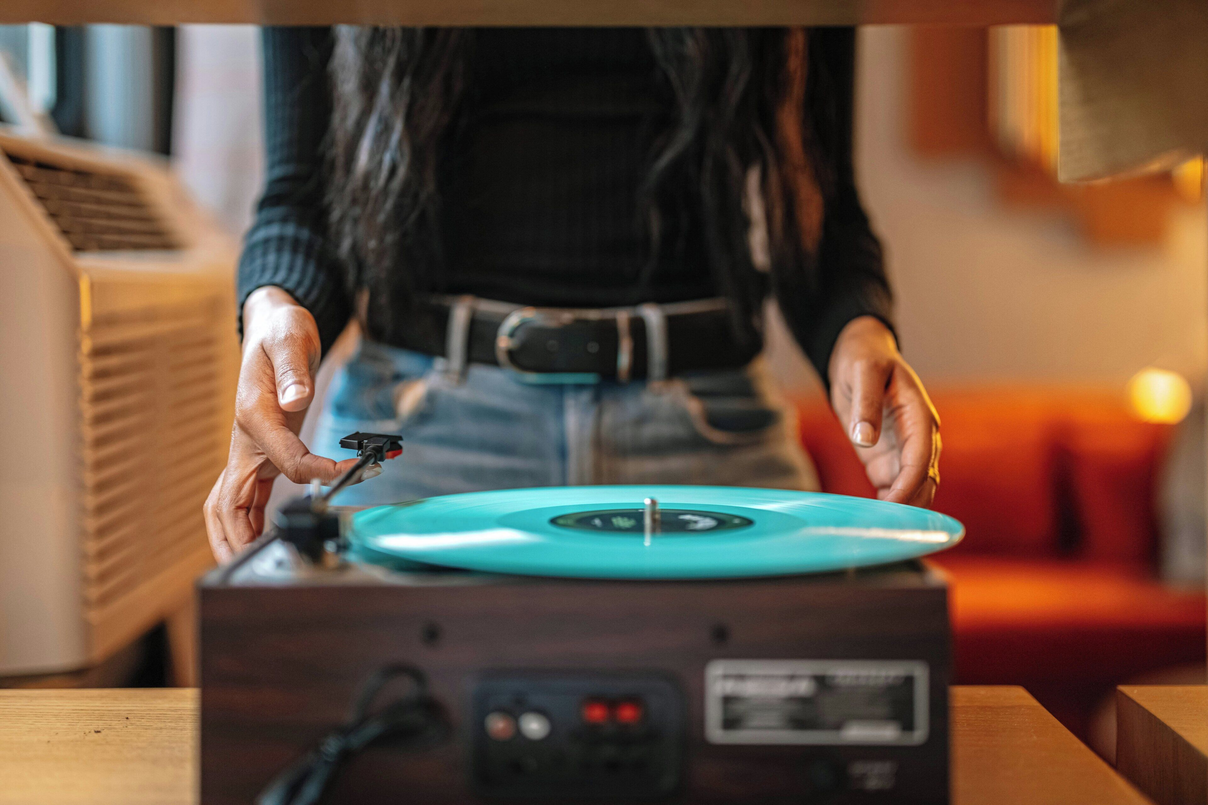 A person operating a turntable.