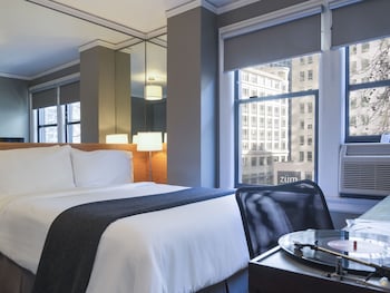 Egyptian cotton sheets, premium bedding, down comforters, pillowtop beds at Hotel Max
