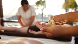 A massage therapy session with a person receiving a treatment.